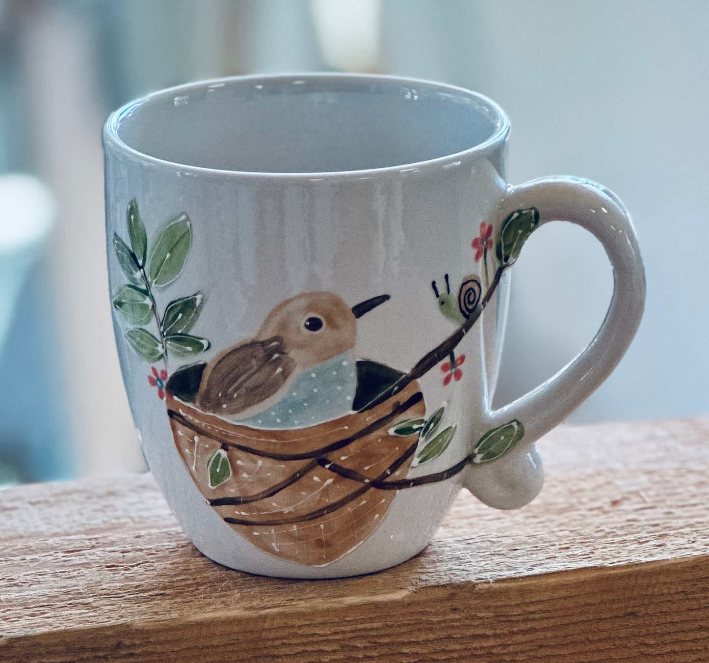 Baby bird in a nest mug