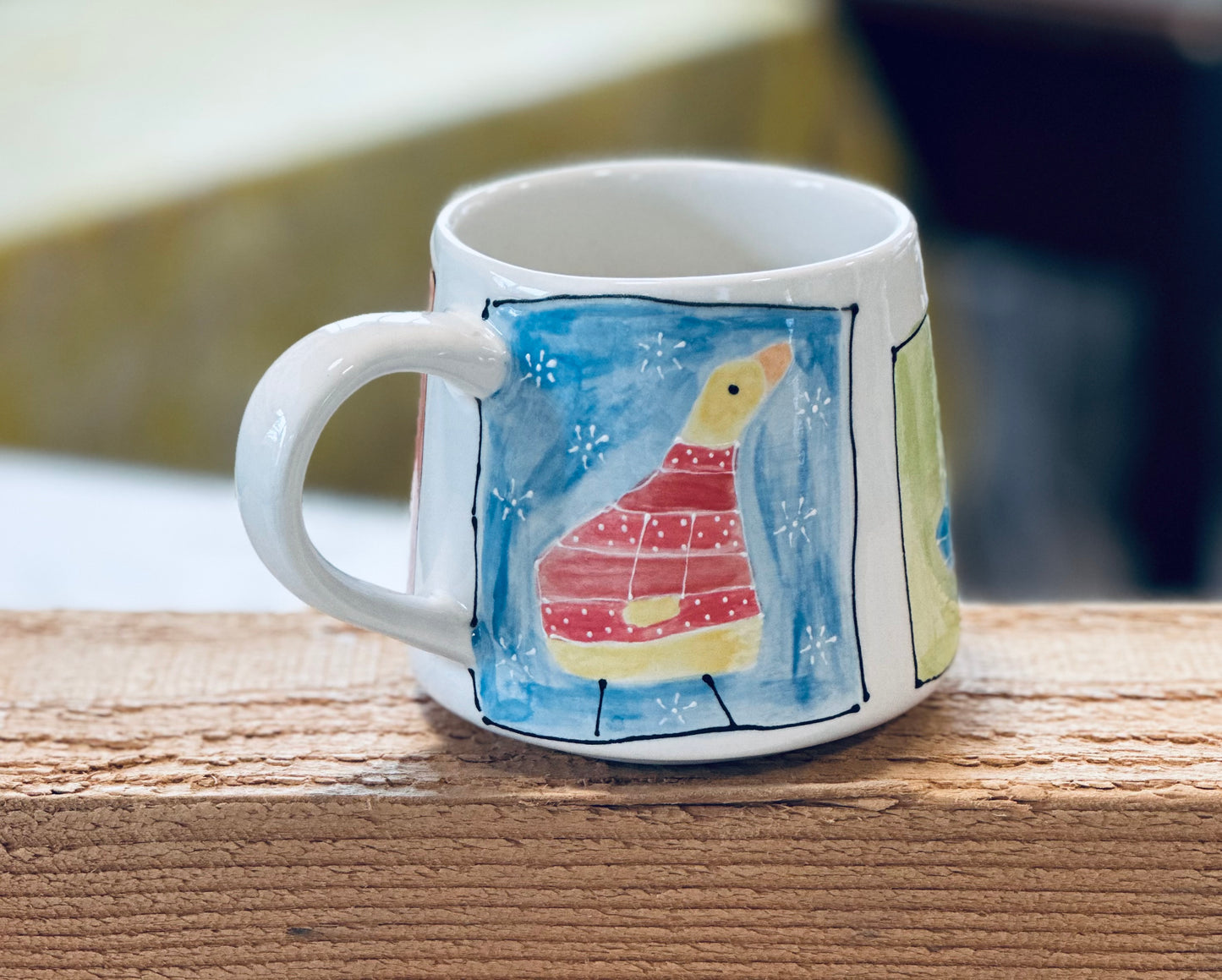 4 framed birds mug
