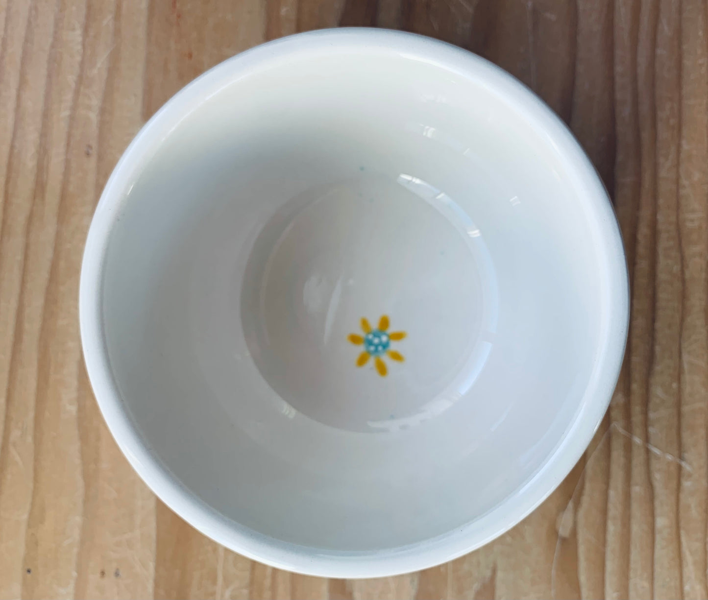Small Bluebird on tea cup bowl