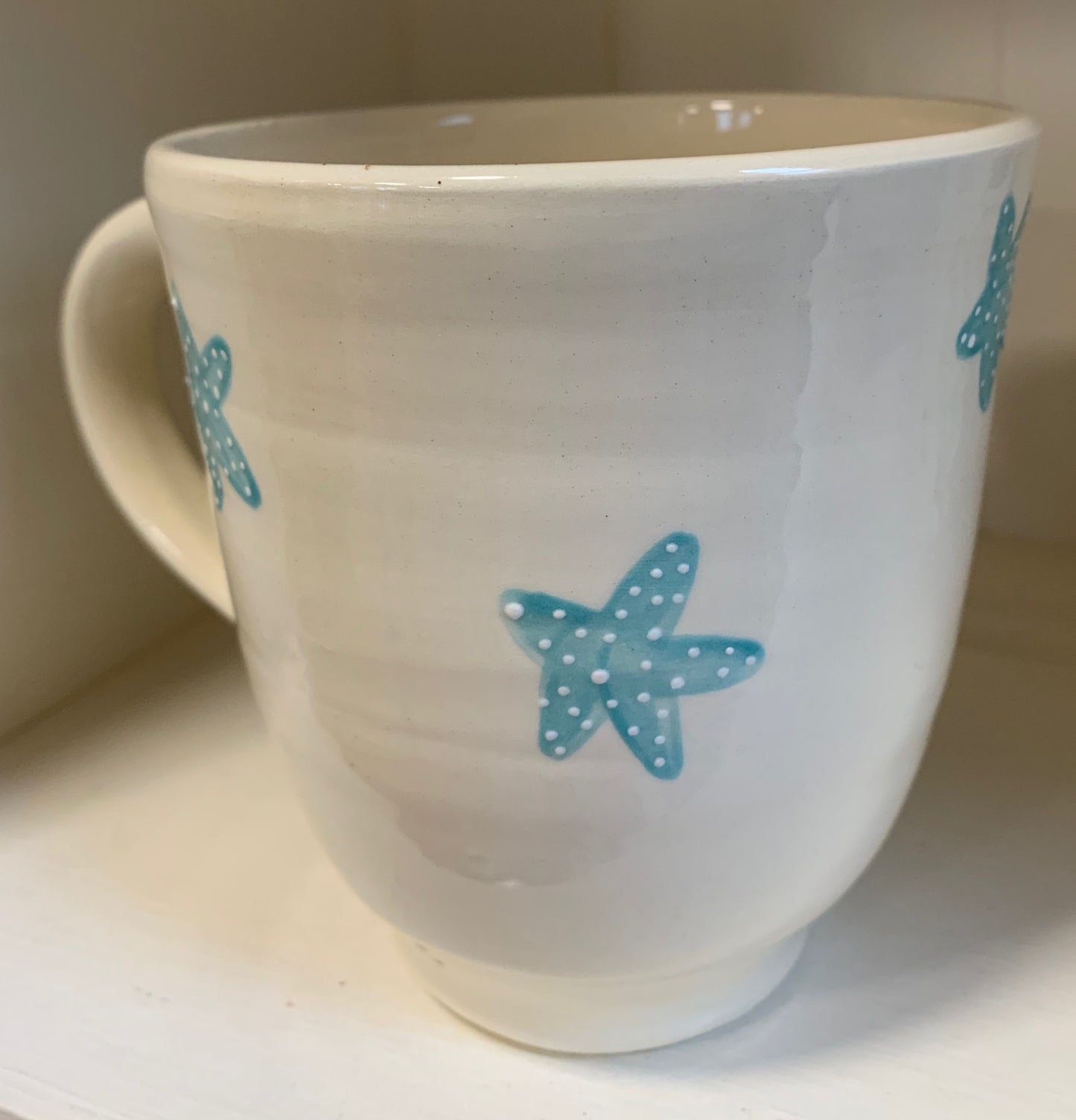 Large wheel thrown mug "Blue & green fish with starfish"
