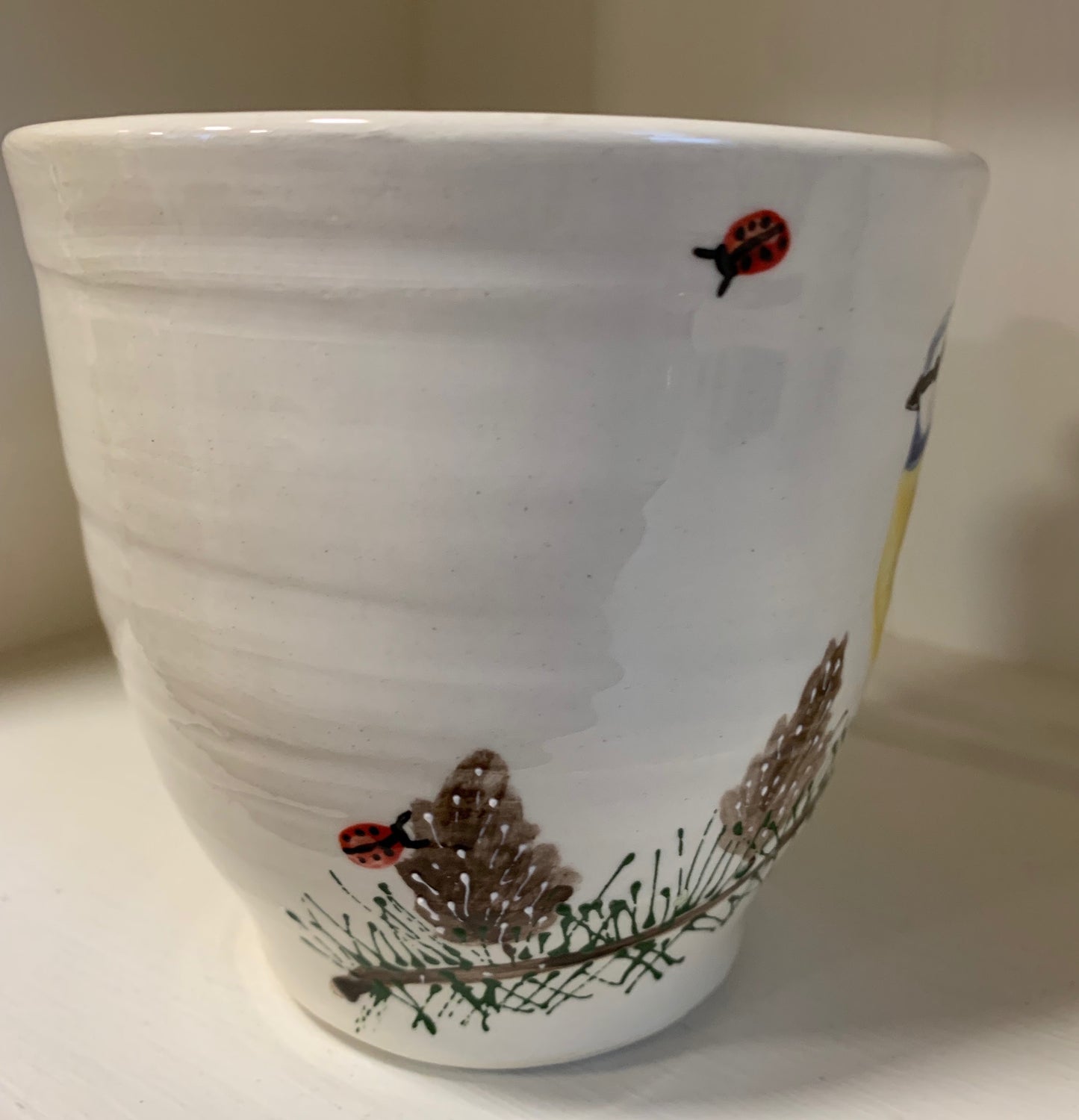 Large wheel thrown mug "Blue Tit and Pinecones"