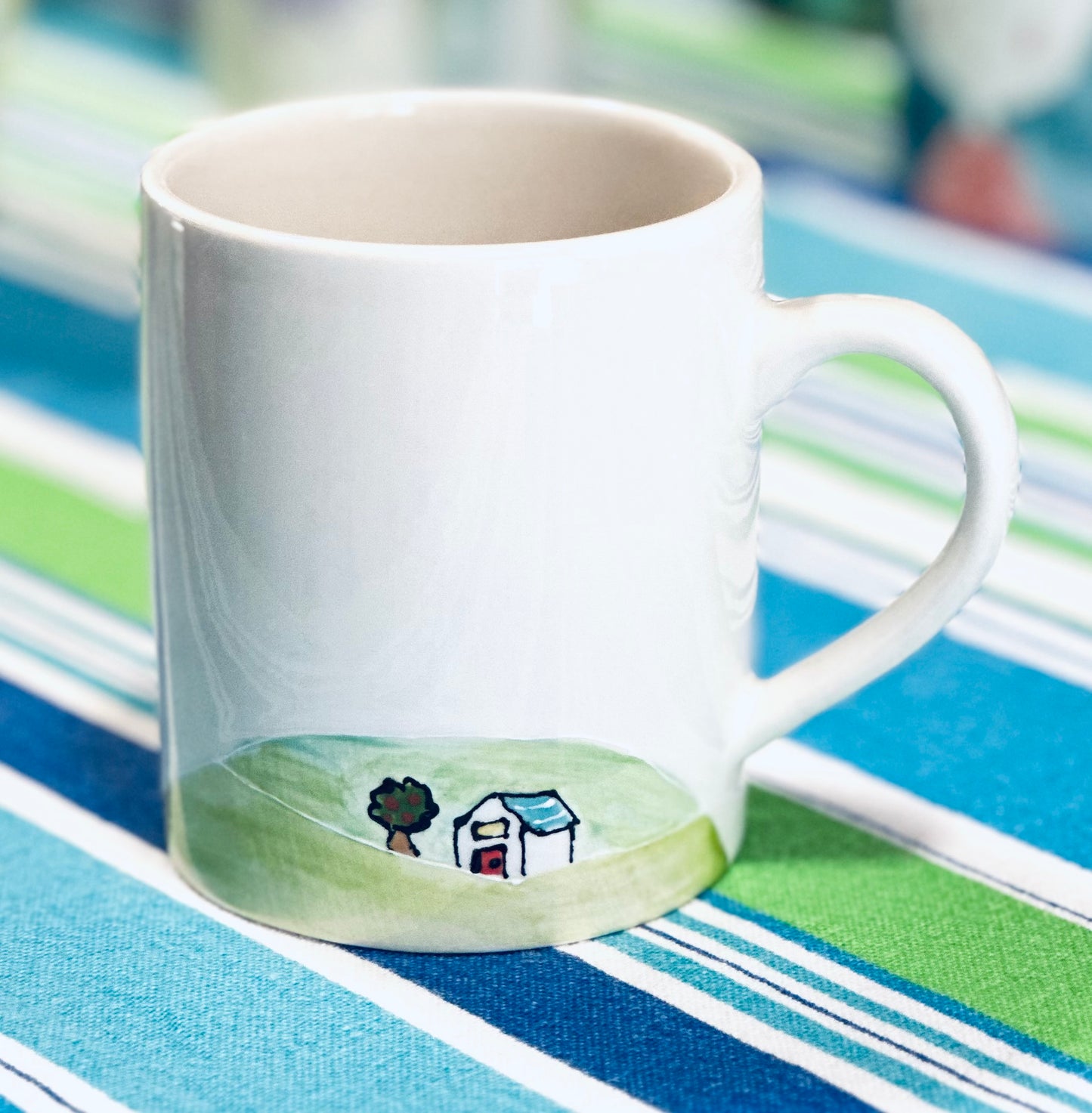 Cottage on a hill mug