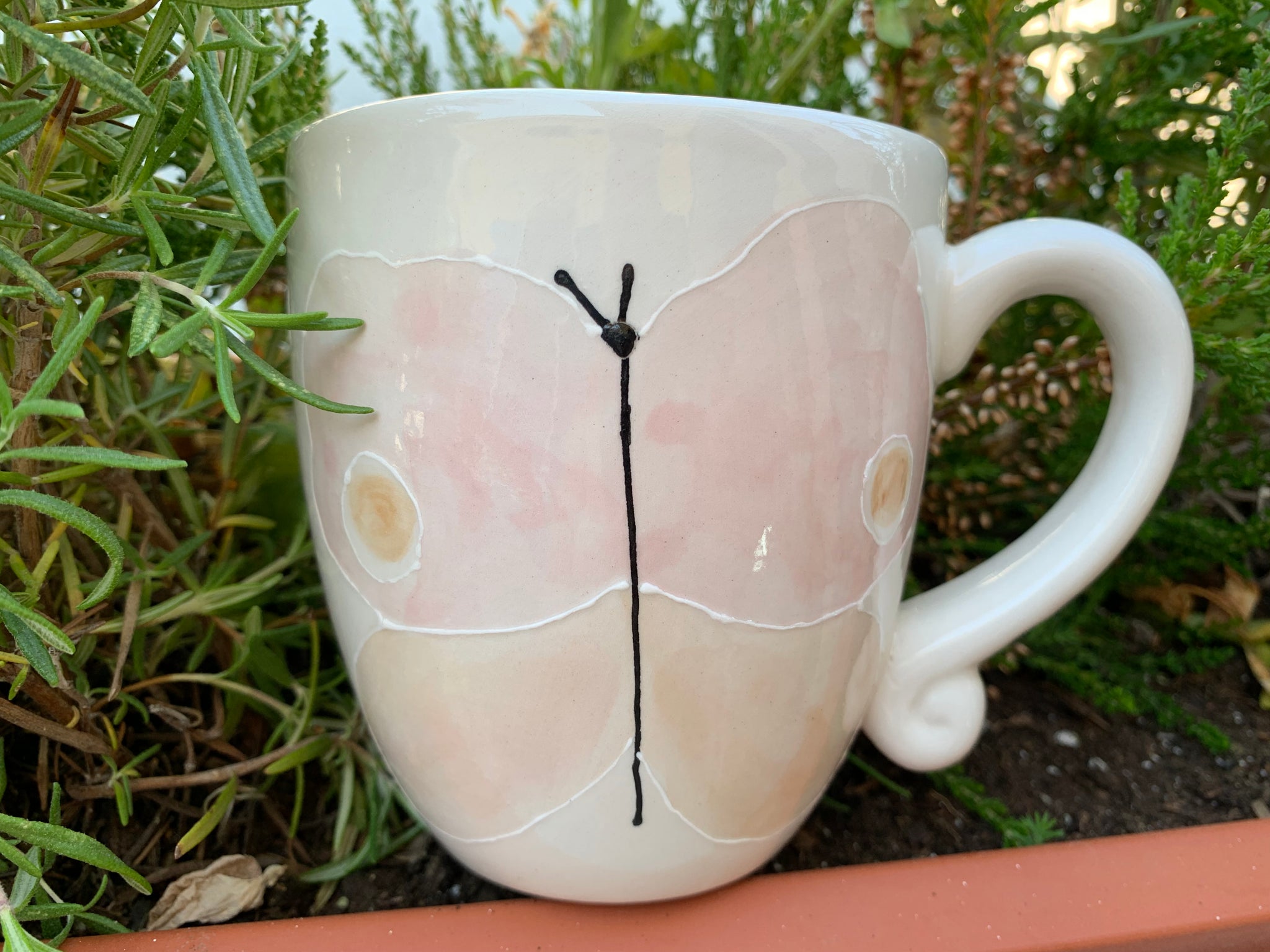 “Pink butterfly facing forward” mug