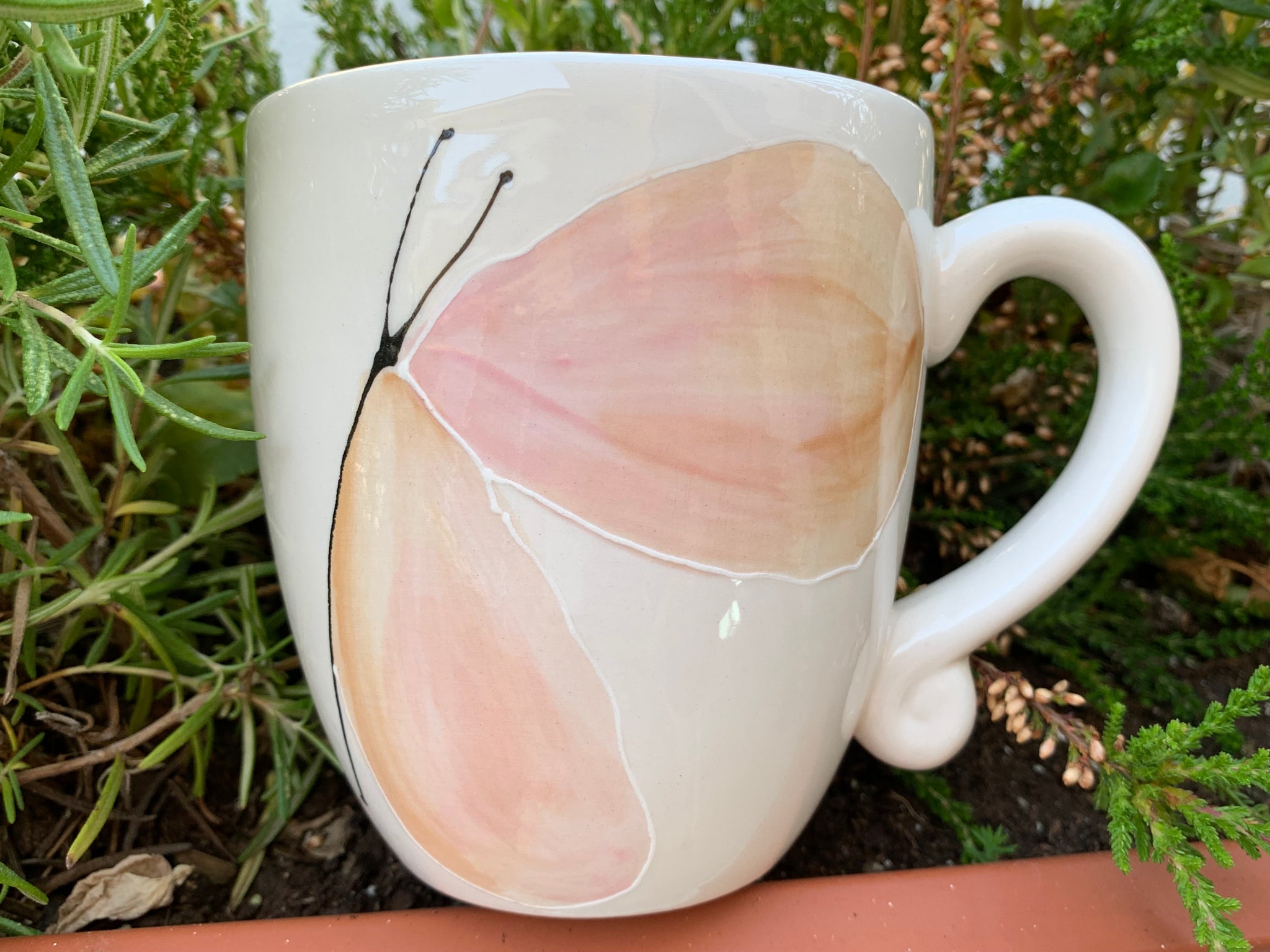 “Pink Butterfly looking up” mug