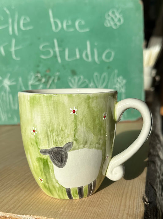 Sheep in the grass mug